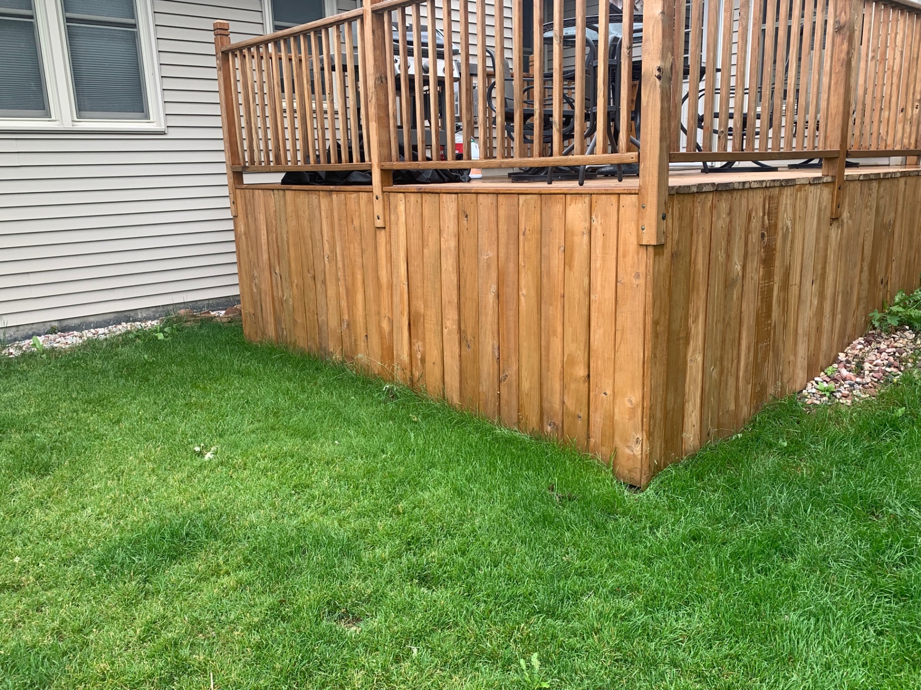 Deck skirt — grass to rock border after