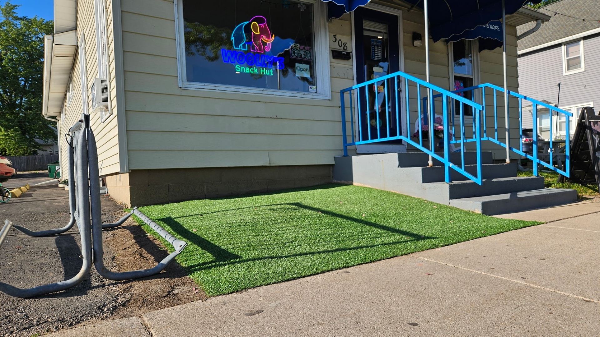 Commercial artificial turf installation in front of a storefront